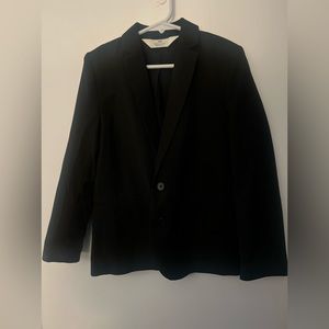 A child’s black blazer with 2 buttons